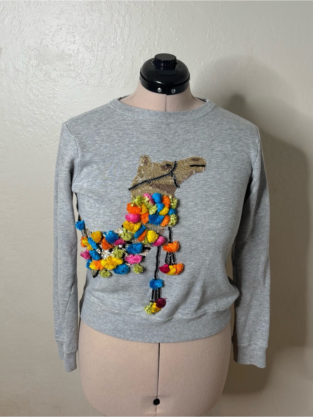Women's Gray Crewneck Sweater with Colorful Pom-Pom Camel Embellishment